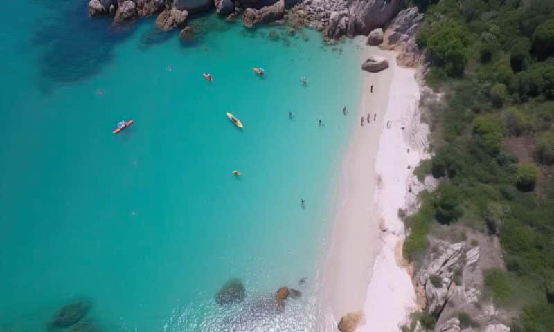 aerial view of a bay with turquoise water where people and kayaks swim. Generative AI