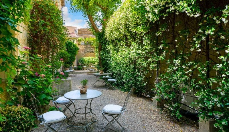 An empty, secluded cafe patio garden in the medieval village of